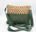 Green and beige two-tone crochet crossbody bag on white background